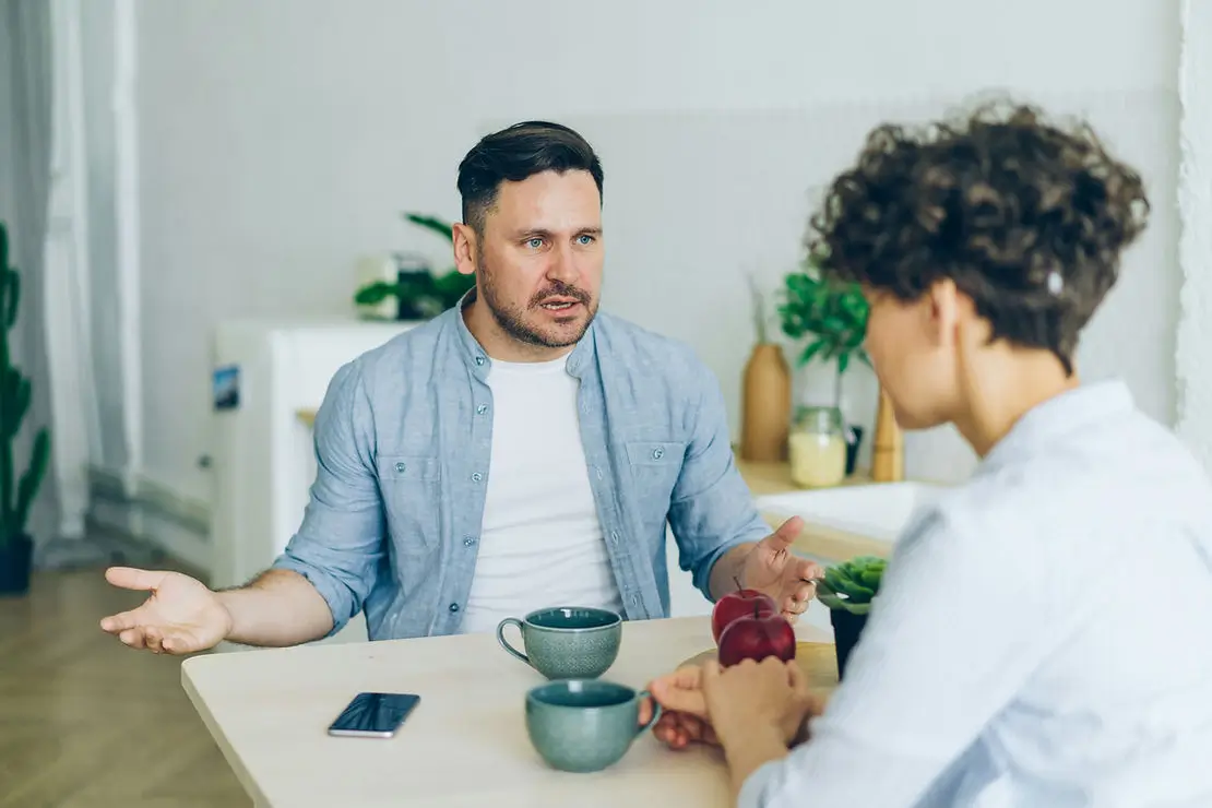 Two people in an intense conversation