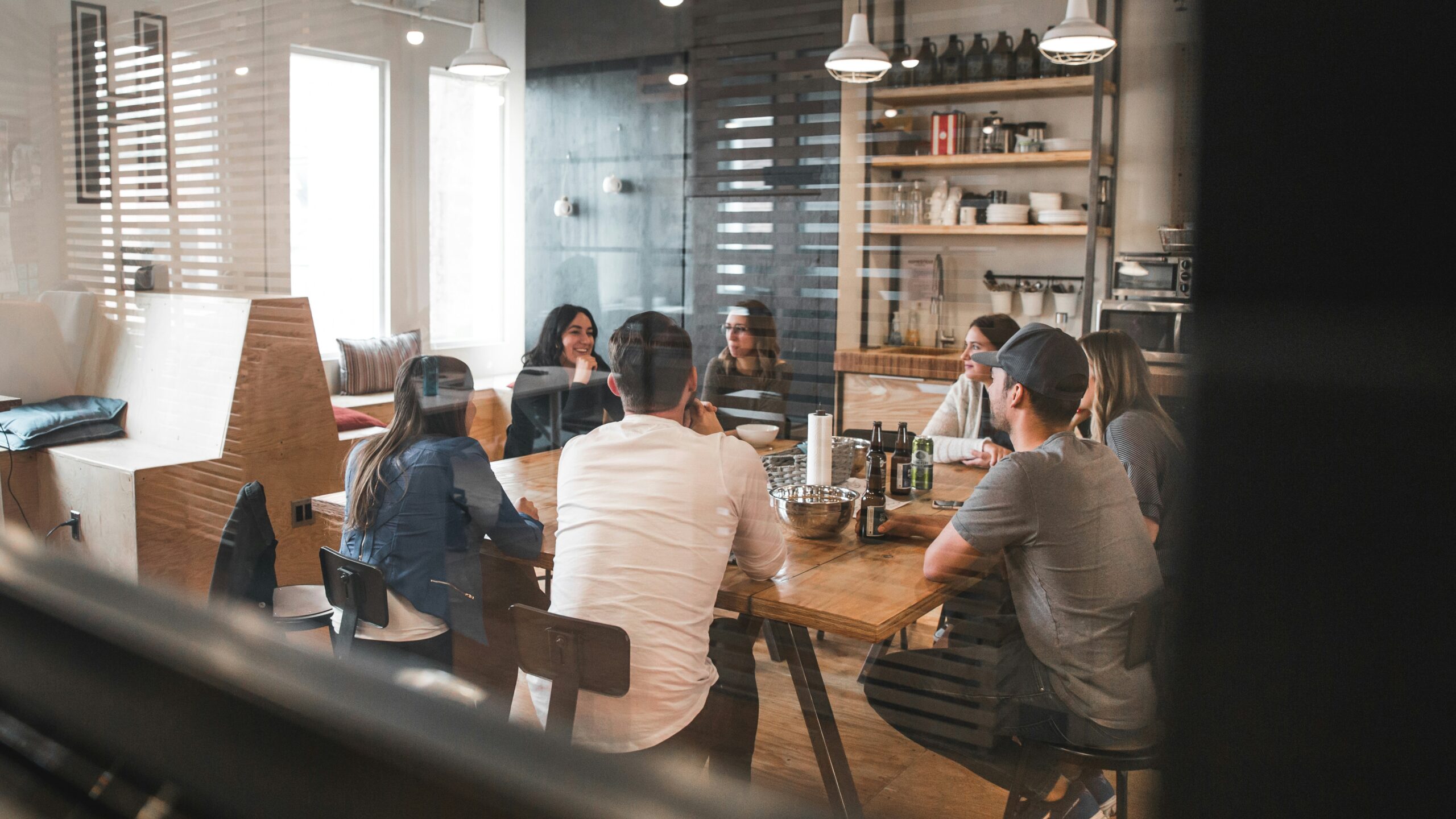 People sitting around a table during a work meeting.